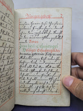 Load image into Gallery viewer, Christkatholisches Gebeth-Büchlein vor jeden guten Christen in welchem Morgen Abend Meß- Beicht und Communion Gebetter zur Hochheiligsten Dreyfaltigkeit. German Manuscript Book of Prayer, 1797. Beautiful Floral Title Border