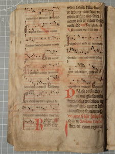 Two Leaf Bifolio from A Latin Missal, Germany, 14th Century. Manuscript on Parchment. 20 Lines of Gothic Script and Musical Notation. Recovered from a Binding