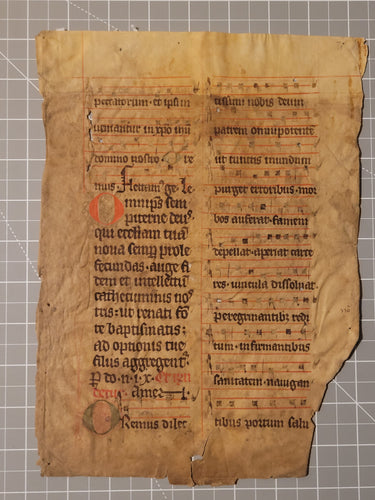 Leaf from a Latin Missal, Germany, 14th Century. Manuscript on Parchment. 18 Lines of Gothic Script and Musical Notation. Recovered from a Binding