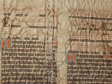 Load image into Gallery viewer, Leaf Fragment from a Latin Missal, Germany, 14th Century. Manuscript on Parchment. 20 Lines of Gothic Script. Musical Notation. Recovered from a Binding