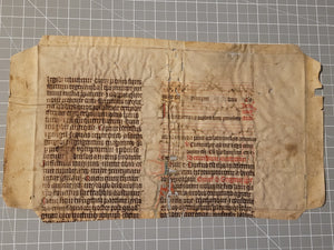 Leaf Fragment from a Latin Missal, Germany, 14th Century. Manuscript on Parchment. 20 Lines of Gothic Script. Musical Notation. Recovered from a Binding