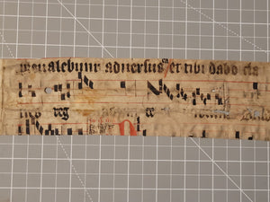 Leaf Fragment from a Latin Missal, Germany, 15th Century. Manuscript on Parchment. &nbsp;Two Lines of Gothic Script and Musical Notation. Recovered from a Binding