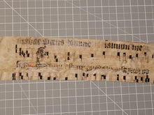 Load image into Gallery viewer, Leaf Fragment from a Latin Missal, Germany, 15th Century. Manuscript on Parchment. &nbsp;Two Lines of Gothic Script and Musical Notation. Recovered from a Binding