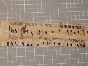 Leaf Fragment from a Latin Missal, Germany, 15th Century. Manuscript on Parchment. &nbsp;Two Lines of Gothic Script and Musical Notation. Recovered from a Binding