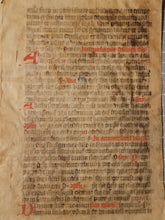 Load image into Gallery viewer, Leaf from a Latin Missal, Germany, 14th Century. Manuscript on Parchment. 33 Lines of Gothic Script, and Red and Blue Initials. Recovered from a Binding