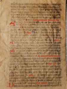 Leaf from a Latin Missal, Germany, 14th Century. Manuscript on Parchment. 33 Lines of Gothic Script, and Red and Blue Initials. Recovered from a Binding