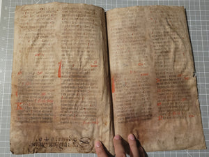 Two Leaf Bifolio from a Latin Missal, Germany, 14th Century. Manuscript on Parchment. 33 Lines of Gothic Script, 7 Large Red Initials. Recovered from a Binding