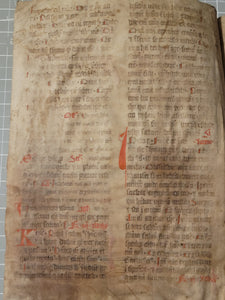 Two Leaf Bifolio from a Latin Missal, Germany, 14th Century. Manuscript on Parchment. 33 Lines of Gothic Script, 7 Large Red Initials. Recovered from a Binding