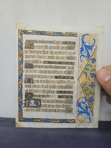 Leaf From an Illuminated Book of Hours with a Historiated Initial, Northern France, Circa 1470. Illuminated Manuscript on Vellum. Psalms 122-123, with a Large Border