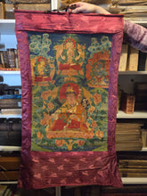 Load image into Gallery viewer, A Thangka of the Manifestation of Padmasambhava, or Guru Rinponche, Accompanied by Several Heavenly and Wrathful Deities, Circa 1880-1920. A Tibetan Painting, Colored Vibrantly