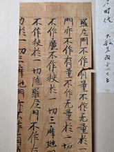Load image into Gallery viewer, Mokuhan he, or Kyōgire (Ancient Manuscript Sutra Fragments), Circa 900-1400. A Surprisingly Varied Collection of 15 Sutra Leaves, Including Illuminated, Indigo Dyed Examples, and a Piece Purportedly Written in Blood and Ink