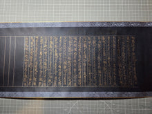 Load image into Gallery viewer, Myohorengekyo (The Lotus Sutra), Circa 1600-1650. An Illuminated, Albeit Incomplete Manuscript Scroll of the Lotus Sutra, on Indigo Dyed Paper