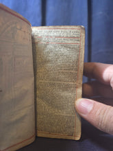 Load image into Gallery viewer, The Holy Bible containing the Old Testament and the New; Bound With; The Whole Book of Psalms Collected into English Meter, 1676/1677. Contemporary Binding with a Curious Spine and Silver Clasp,  and Early Women Ownership Inscriptions