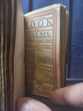 Load image into Gallery viewer, The Holy Bible containing the Old Testament and the New; Bound With; The Whole Book of Psalms Collected into English Meter, 1676/1677. Contemporary Binding with a Curious Spine and Silver Clasp,  and Early Women Ownership Inscriptions